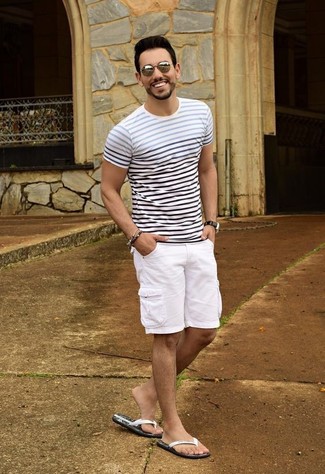 White Rubber Sandals Outfits For Men: This combo of a white and navy horizontal striped crew-neck t-shirt and white shorts is hard proof that a pared down casual outfit can still be really sharp. Avoid looking too formal by finishing off with white rubber sandals.