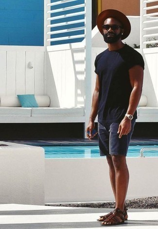 Dark Brown Leather Sandals Outfits For Men: Perfect the neat and relaxed look in a navy crew-neck t-shirt and navy denim shorts. Go ahead and complete this look with a pair of dark brown leather sandals for a more casual feel.