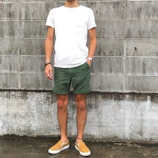 Slip-on Sneakers Outfits For Men: You're looking at the solid proof that a white crew-neck t-shirt and olive shorts look awesome when worn together in a relaxed look. Feeling adventerous? Change up your look by rounding off with slip-on sneakers.