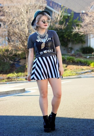 Grey Print Crew-neck T-shirt Outfits For Women: Uber stylish, this pairing of a grey print crew-neck t-shirt and a white and black vertical striped skater skirt delivers variety. Clueless about how to finish? Introduce black suede ankle boots to your outfit to turn up the wow factor.