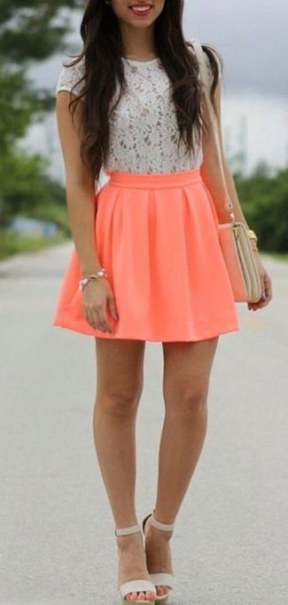 Orange Skater Skirt Outfits: One of the coolest ways to style out a white lace crew-neck t-shirt is to team it with an orange skater skirt. Puzzled as to how to finish off? Add grey leather heeled sandals to the mix to step up the wow factor.