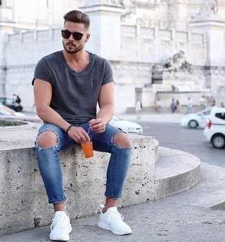 Men's Grey Crew-neck T-shirt, Blue Ripped Skinny Jeans, White Athletic Shoes, Dark Brown Sunglasses