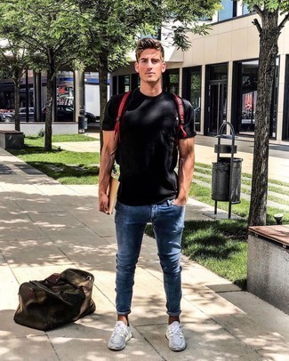 Dark Brown Canvas Duffle Bag Outfits For Men: Go for a straightforward but casually cool choice by putting together a black crew-neck t-shirt and a dark brown canvas duffle bag. To give this look a more elegant touch, add grey athletic shoes to the equation.