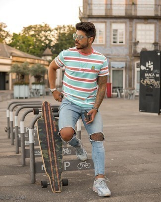 Light Blue Ripped Skinny Jeans Outfits For Men: If you feel more confident in comfortable clothes, you'll love this modern casual pairing of a mint horizontal striped crew-neck t-shirt and light blue ripped skinny jeans. Grey athletic shoes are a good option to finish this ensemble.