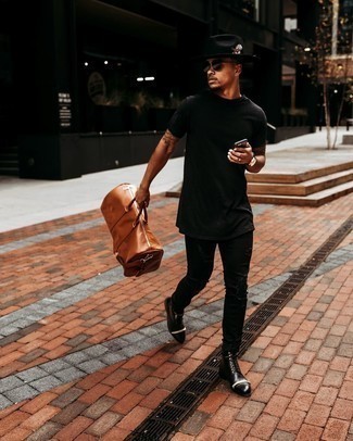 Black Hat Outfits For Men: This off-duty pairing of a black crew-neck t-shirt and a black hat takes on different moods according to how you style it out. Tap into some Ryan Gosling dapperness and smarten up your getup with black leather casual boots.