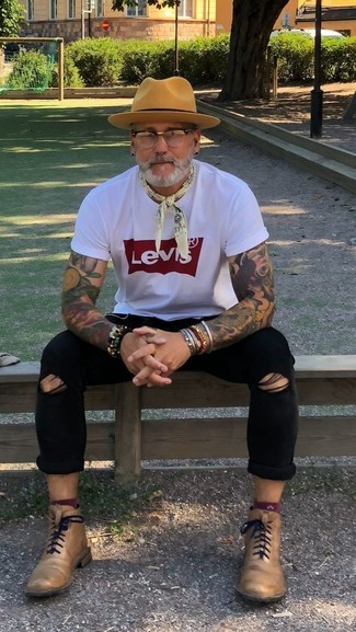 Men's White and Red Print Crew-neck T-shirt, Black Ripped Skinny Jeans, Tan Leather Dress Boots, Tan Wool Hat
