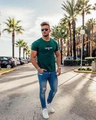 Men's Dark Green Print Crew-neck T-shirt, Blue Ripped Skinny Jeans, White Leather Low Top Sneakers, Black Sunglasses