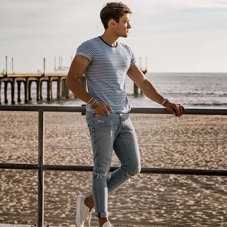 White and Blue Horizontal Striped Crew-neck T-shirt Outfits For Men: Who said you can't make a stylish statement with a relaxed outfit? Turn every head in the room in a white and blue horizontal striped crew-neck t-shirt and light blue ripped skinny jeans. Add beige canvas low top sneakers to this ensemble to instantly shake up the look.