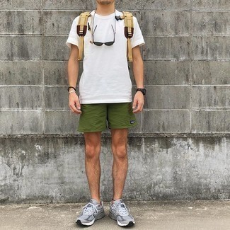 Men's Outfits 2021: When the situation allows an off-duty look, marry a white crew-neck t-shirt with olive sports shorts. A pair of grey athletic shoes is a nice pick to complement this ensemble.