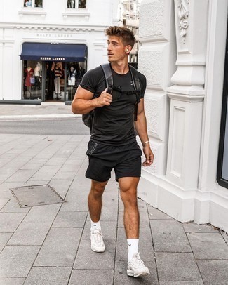 Sports Shorts Outfits For Men: For relaxed dressing with a city style spin, you can always rely on a black crew-neck t-shirt and sports shorts. Finish off with grey athletic shoes for maximum fashion effect.