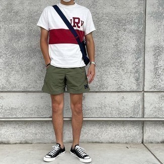 White and Red Print Crew-neck T-shirt Outfits For Men: This pairing of a white and red print crew-neck t-shirt and olive sports shorts is proof that a safe off-duty outfit can still be really interesting. Bump up this whole outfit by slipping into a pair of black and white canvas low top sneakers.