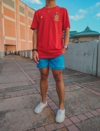 Burgundy Crew-neck T-shirt Outfits For Men: A burgundy crew-neck t-shirt and aquamarine sports shorts are definitely worth being on your list of veritable casual must-haves. To add a bit of flair to this look, complement this look with a pair of white canvas low top sneakers.