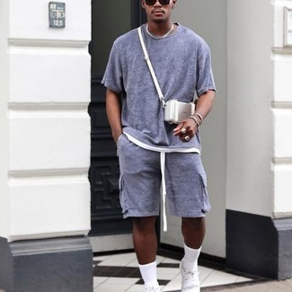 Aquamarine Shorts Outfits For Men: Try teaming a light blue crew-neck t-shirt with aquamarine shorts for an edgy look that's easy to put together. Let your sartorial sensibilities really shine by completing this getup with a pair of white canvas low top sneakers.