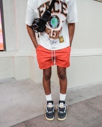 Orange Sports Shorts Outfits For Men: For the style that looks as chill as it can get, choose a white print crew-neck t-shirt and orange sports shorts. Feeling adventerous today? Mix things up a bit with a pair of black and white canvas low top sneakers.
