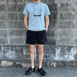 Navy Sports Shorts Outfits For Men: For a cool and casual ensemble, team a light blue crew-neck t-shirt with navy sports shorts — these pieces go really good together. For something more on the casual side to round off your outfit, complete your look with a pair of black canvas sandals.