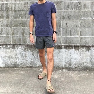 Men's Outfits 2021: If you're in search of an urban but also dapper look, rock a violet crew-neck t-shirt with charcoal sports shorts. To introduce an element of stylish casualness to this ensemble, introduce beige suede sandals to the equation.