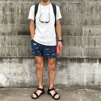 Black Canvas Sandals Outfits For Men: This pairing of a white crew-neck t-shirt and navy print sports shorts combines comfort and dapper menswear style. And if you want to easily dial down your ensemble with one piece, rock a pair of black canvas sandals.
