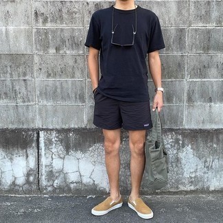 Black Crew-neck T-shirt Outfits For Men: Marry a black crew-neck t-shirt with black sports shorts for a laid-back twist on day-to-day style. Complete your ensemble with tan canvas slip-on sneakers to immediately rev up the fashion factor of your ensemble.