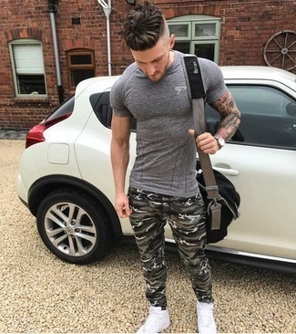 Camouflage Sweatpants Hot Weather Outfits For Men: A grey horizontal striped crew-neck t-shirt and camouflage sweatpants are a wonderful look to integrate into your daily casual lineup. This ensemble is complemented really well with white canvas high top sneakers.