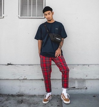 Red Plaid Sweatpants Outfits For Men: Make a navy crew-neck t-shirt and red plaid sweatpants your outfit choice to feel absolutely confident and look stylish. Take a classic approach with shoes and add a pair of tobacco suede low top sneakers to this look.