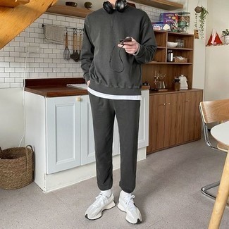 Grey Athletic Shoes Relaxed Warm Weather Outfits For Men In Their 30s: A white crew-neck t-shirt and a charcoal track suit are the kind of a winning casual outfit that you need when you have zero time. This ensemble is completed wonderfully with grey athletic shoes. Perfect if you're looking for some incredibly inspiring style for 30-something Millennial guys.