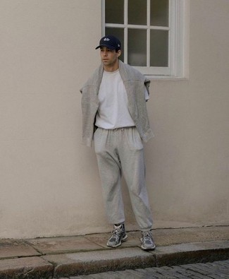 500+ Relaxed Warm Weather Outfits For Men: If the setting permits casual street dressing, pair a white crew-neck t-shirt with a grey track suit. Let your outfit coordination expertise truly shine by complementing this outfit with grey athletic shoes.