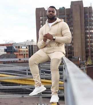 Tan Track Suit Outfits For Men: For something more on the cool and casual end, you can always rely on a tan track suit and a white crew-neck t-shirt. Complement this look with a pair of white athletic shoes and you're all set looking incredible.