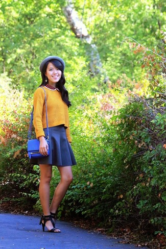 Women's Yellow Knit Cropped Sweater, Navy Skater Skirt, Black Leather Heeled Sandals, Blue Leather Crossbody Bag