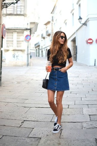 Navy Denim Button Skirt Outfits: If you're seeking to take your casual game to a new height, dress in a black cropped top and a navy denim button skirt. Let your styling sensibilities really shine by completing your look with a pair of black and white canvas low top sneakers.
