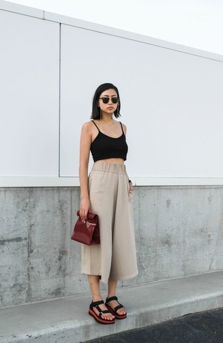 Black Cropped Top Outfits: The styling capabilities of a black cropped top and beige culottes guarantee they'll be on regular rotation. Let your outfit coordination skills truly shine by finishing your ensemble with black suede flat sandals.