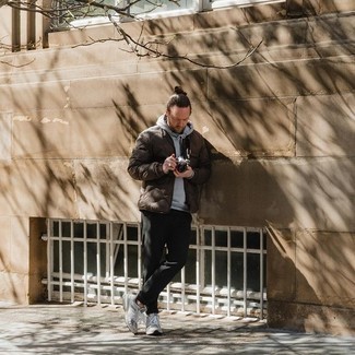 Dark Brown Bomber Jacket Outfits For Men: Extra stylish, this casual pairing of a dark brown bomber jacket and black chinos provides with wonderful styling opportunities. Finishing with grey athletic shoes is a guaranteed way to introduce a hint of stylish nonchalance to this ensemble.