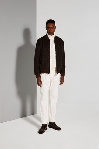 To put together a casual menswear style with a modern finish, you can easily wear a dark brown wool bomber jacket and white chinos. Tap into some Idris Elba dapperness and polish up your ensemble with dark brown leather chelsea boots.