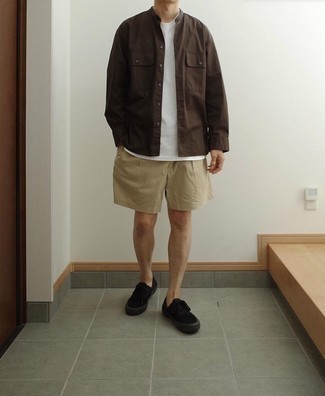 Black Canvas Low Top Sneakers Outfits For Men: This combination of a dark brown long sleeve shirt and tan shorts is clean, sharp and very easy to replicate. Complete this look with black canvas low top sneakers and you're all done and looking amazing.