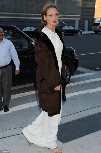 Uma Thurman wearing Dark Brown Shearling Coat, White Maxi Dress, Beige Elastic Heeled Sandals