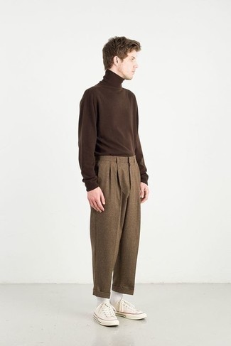 Dark Brown Wool Chinos Outfits: This off-duty combination of a dark brown turtleneck and dark brown wool chinos is very easy to throw together without a second thought, helping you look seriously stylish and ready for anything without spending too much time going through your closet. Complement your look with white canvas low top sneakers to avoid looking too polished.