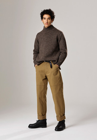 Dark Brown Wool Turtleneck Outfits For Men: Stylish yet practical, this outfit combines a dark brown wool turtleneck and khaki chinos. Black leather desert boots integrate effortlessly within a great deal of outfits.