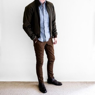 Dark Green Bomber Jacket Outfits For Men: You're looking at the indisputable proof that a dark green bomber jacket and brown chinos are amazing when matched together in an off-duty look. As for the shoes, go down a classier route with dark brown leather casual boots.