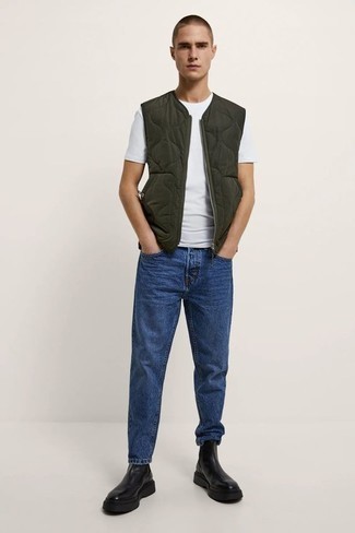 Olive Quilted Gilet Outfits For Men: To create a relaxed casual look with a modern spin, reach for an olive quilted gilet and navy jeans. Up your look with black leather chelsea boots.