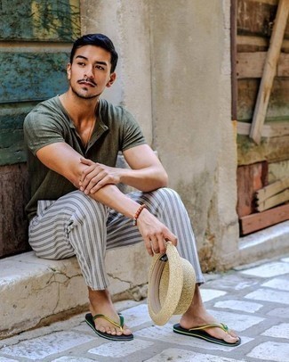 Beige Straw Hat Outfits For Men: To achieve an off-duty getup with a street style take, go for a dark green henley shirt and a beige straw hat. Add a pair of green flip flops to the equation to easily step up the cool of this ensemble.