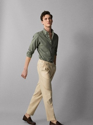 Dark Green Long Sleeve Shirt Outfits For Men: Choose a dark green long sleeve shirt and khaki chinos for a casually stylish and stylish ensemble. Go for a pair of dark brown leather loafers for an added touch of style.