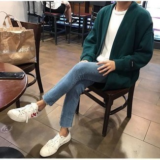 White Print Canvas Low Top Sneakers Outfits For Men: A dark green open cardigan and light blue jeans work together smoothly. White print canvas low top sneakers are a welcome accompaniment to your ensemble.