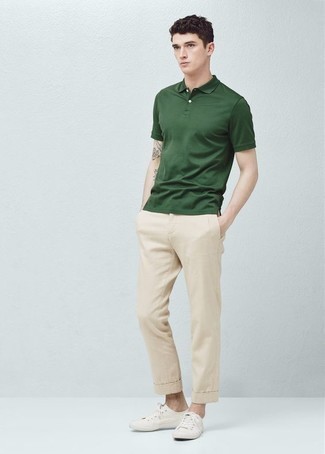 Dark Green Polo Outfits For Men: Reach for a dark green polo and beige chinos for both on-trend and easy-to-style look. Introduce white canvas low top sneakers to this outfit and the whole look will come together quite nicely.