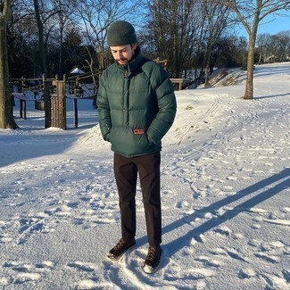 Boots Outfits For Men: This look with a dark green puffer jacket and dark brown chinos isn't a hard one to assemble and easy to change. Boots tie the getup together.