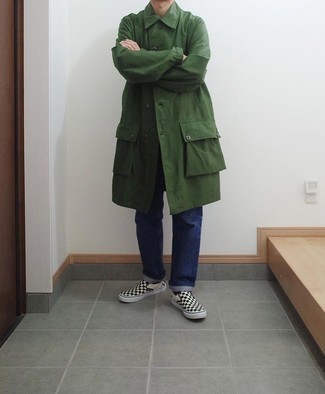 Dark Green Raincoat Outfits For Men: If you're on a mission for a relaxed but also sharp ensemble, team a dark green raincoat with navy jeans. Throw black and white check canvas slip-on sneakers into the mix and the whole outfit will come together.