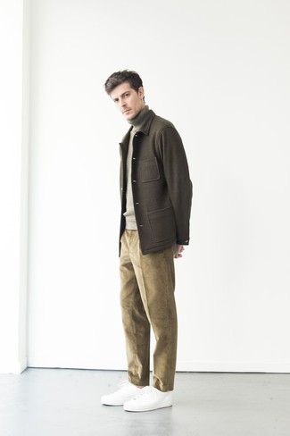 Olive Wool Shirt Jacket Outfits For Men: You'll be amazed at how very easy it is for any gent to get dressed like this. Just an olive wool shirt jacket and khaki corduroy chinos. For a more casual spin, why not add a pair of white canvas low top sneakers to this outfit?