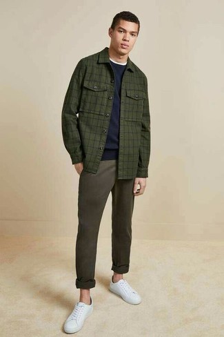 Sneakers Outfits For Men: Uber dapper and comfortable, this relaxed combo of a dark green check shirt jacket and charcoal chinos will provide you with variety. Feeling creative? Dial down your ensemble with sneakers.