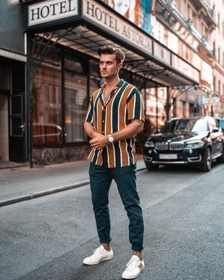 Men's Dark Green Vertical Striped Short Sleeve Shirt, Dark Green Chinos, White Canvas Low Top Sneakers, White Leather Watch
