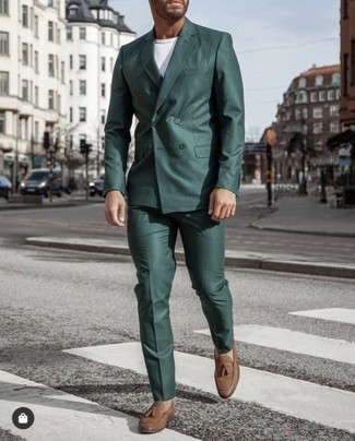 Dark Brown Leather Tassel Loafers Smart Casual Outfits: For a casually stylish ensemble, choose a dark green suit and a white crew-neck t-shirt — these two items go perfectly well together. And if you need to instantly smarten up your ensemble with one piece, slip into dark brown leather tassel loafers.