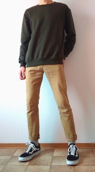Dark Green Sweatshirt Outfits For Men: If you want to feel confident in your outfit, consider wearing a dark green sweatshirt and khaki chinos. This ensemble is rounded off nicely with a pair of black and white canvas low top sneakers.
