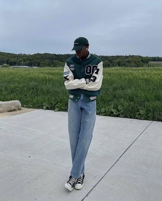 Dark Green Varsity Jacket Outfits For Men: Rock a dark green varsity jacket with light blue jeans to feel fully confident and look trendy. Black and white canvas high top sneakers are guaranteed to bring a touch of stylish effortlessness to this ensemble.